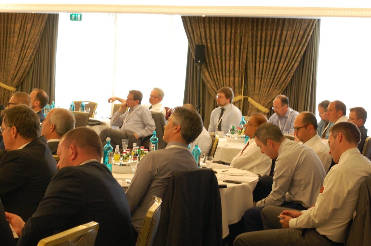 Delegates seated at round tables during a previous Zenith Group event